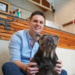 Meaningful Ways Having A Pet Changes Your Life For The Better man and with his pet dog playing on the floor hap 2022 11 14 09 04 35 utc cropped