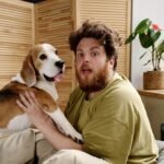 10 Signs That You May Need a New Pet man fooling around with his pet 2022 05 02 15 33 57 utc cropped